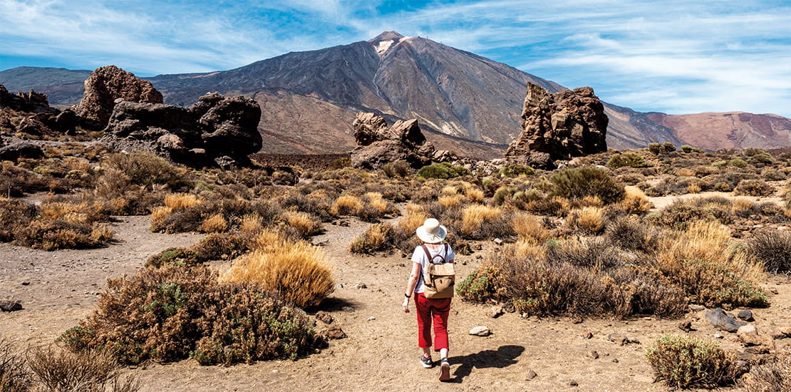 A woman hiking in Teide National Park in Tenerife, Canary Islands